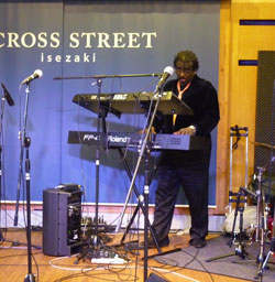 bayo singing with hands lifted